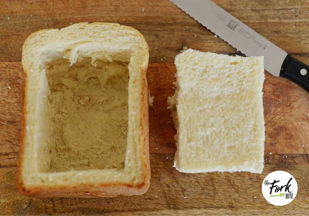 Slice 5-inch thick unsliced sandwich bread in half. Then cut out a square: make 2 incisions vertically on top and another 2 incisions horizontally.