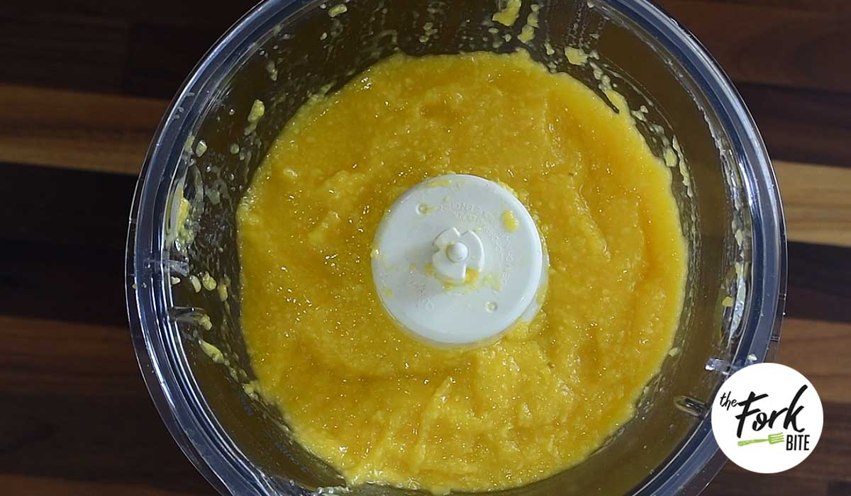 Place mango in a food processor or blender and whizz until smooth.