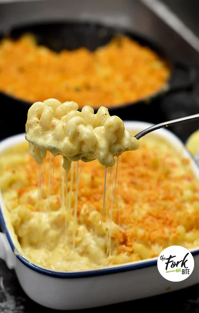 Creamy Baked Mac and Cheese - This is one of my family favorite recipes. It's so cheesy, creamy with tons of rich cheese sauce and topped with Doritos making it extra delicious!