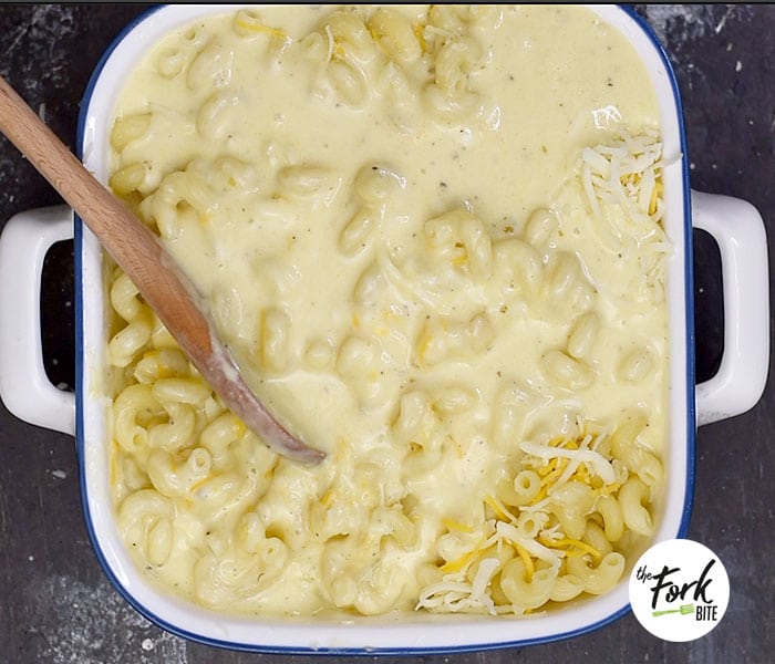 Toss some butter over the freshly drained macaroni pasta so they'll be slightly coated to help stop from absorbing more liquid as it bakes.