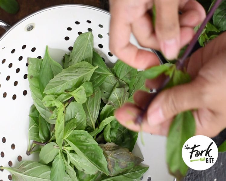 Now comes the best part! Fold the basil leaves into the chicken. If you’re using a gas stove, turn the flame off. If you have an electric stove, turn off the heat and move the wok out from the burner.