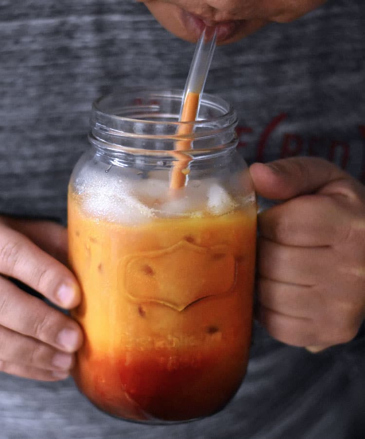 Now you can skip the line at the coffee shop and enjoy Thai Iced Tea at home with this super-easy recipe that tastes like the authentic version of this beloved creamy and sweet Thai tea beverage!