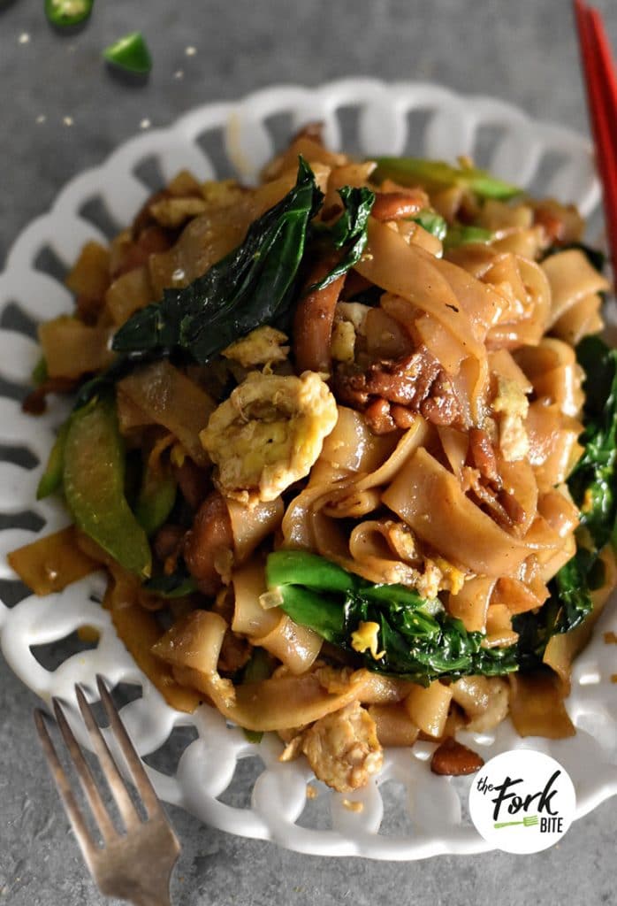 One of the epitome of Thai street foods, Pad See Ew is a Thai Stir Fry Noodle Dish made with extra thick rice noodles in a sweet and savory sauce and can be done in less than 30 minutes.