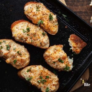 Super easy bite-sized crispy, baked Shrimp Toast topped with creamiest, cheesiest shrimp spread topping. Let these finger foods a life of your party.