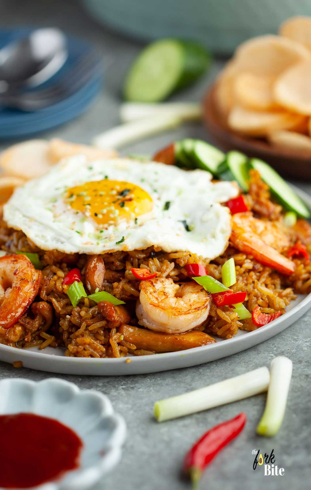 Making this dish is clear-cut, just like other recipes for fried rice. You cook the fried egg first and set it aside.  Then, you sauté the aromatics, then the meat, followed by the rice, and then season with kecap manis and shrimp paste (if you prefer).