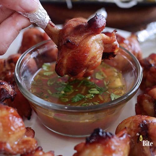 These baked chicken lollipop appetizers are perfect finger food and are shaped like a lollipop. Marinated with hoisin ginger and baked to juicy deliciousness.