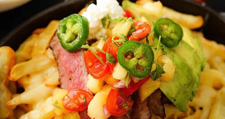 We took these loaded steak fries to the next level, topped with gooey, melted cheese and layered with pineapple Pico De Gallo and of course, with smokin' juicy steak.