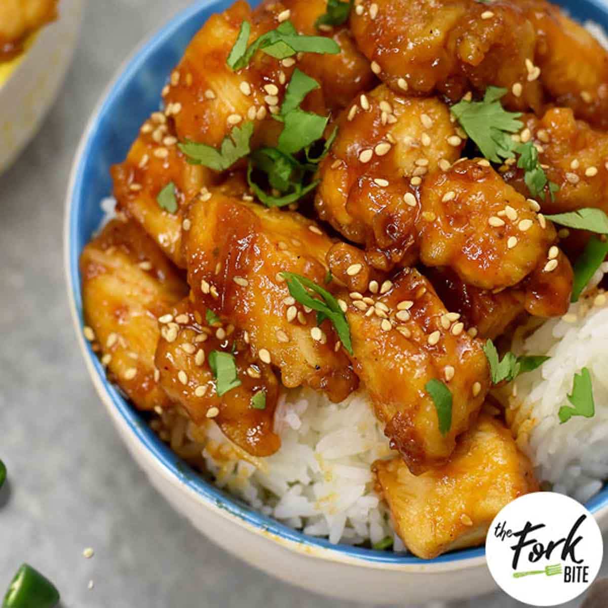 This finger-lickin’ crispy sesame chicken recipe underneath a sticky and sweet honey sauce is super easy to make. Comes together in 30 minutes, served with rice and you’ll never need a takeout again!