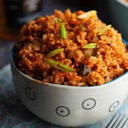 Here’s the right way to make Arroz Rojo in your kitchen. The rice is not only soft and fluffy but is not sticky and has the perfect chew.