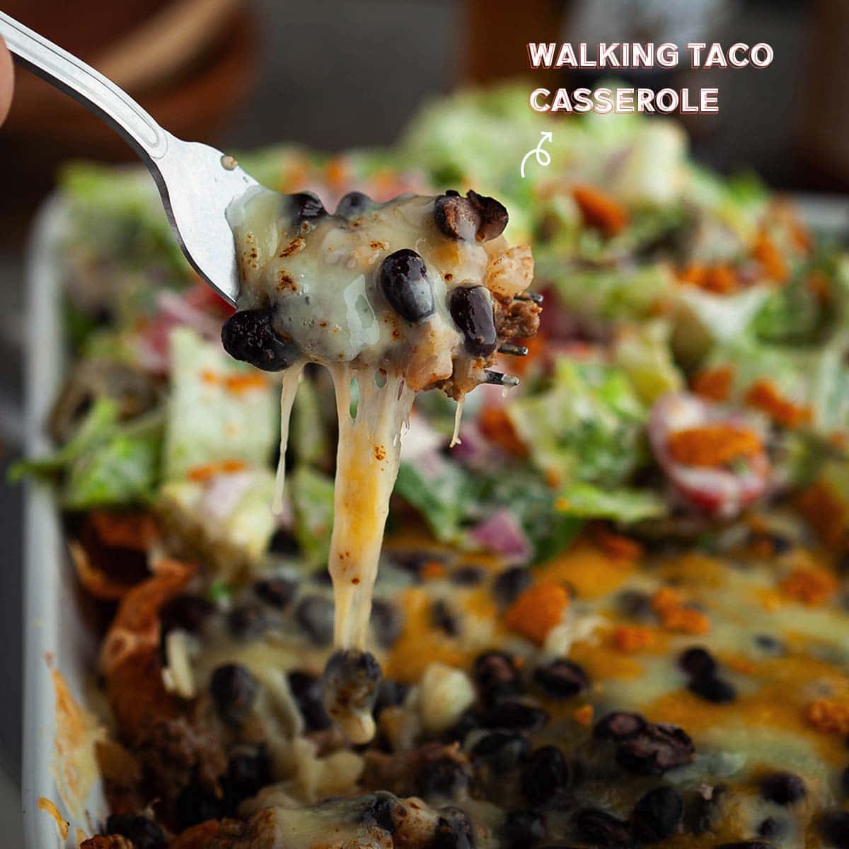For this walking taco recipe, I love using crunchy Frito corn chips. It puts “walking” in this walking taco meat casserole. My kids love it! They even eat all the black beans and meat that I bake with a thick layer of cheddar.
