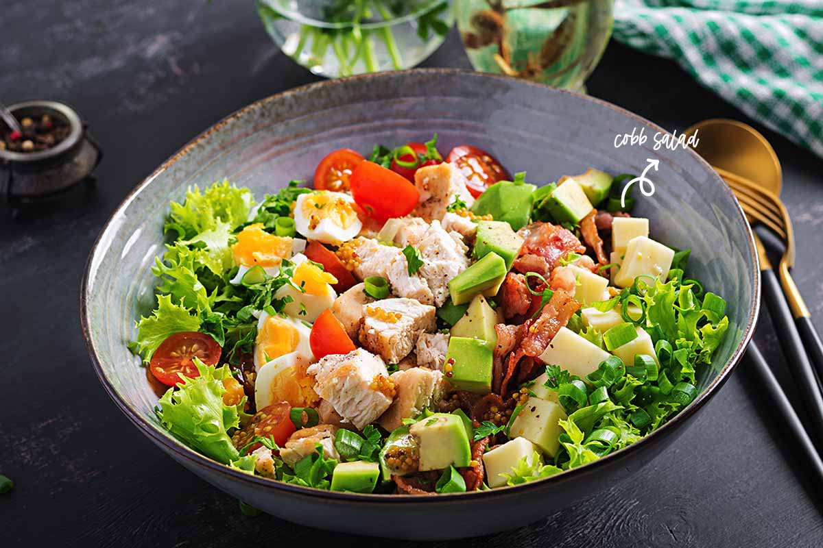 One of the best side dishes I could think of is a chicken cobb salad. It has all the elements my family loves—chicken, cheese, turkey, bacon, and honey.