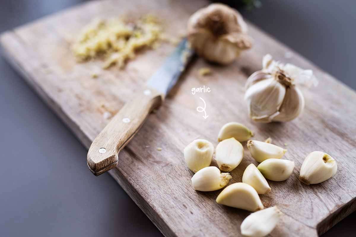 Peel some cloves of garlic and finely chop or you throw them whole into the food processor.