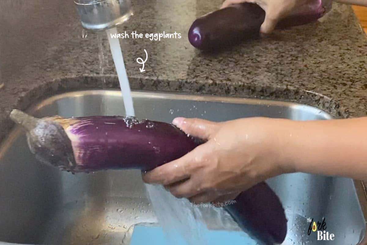 Simply rinse the eggplant under the faucet with cold or lukewarm water.