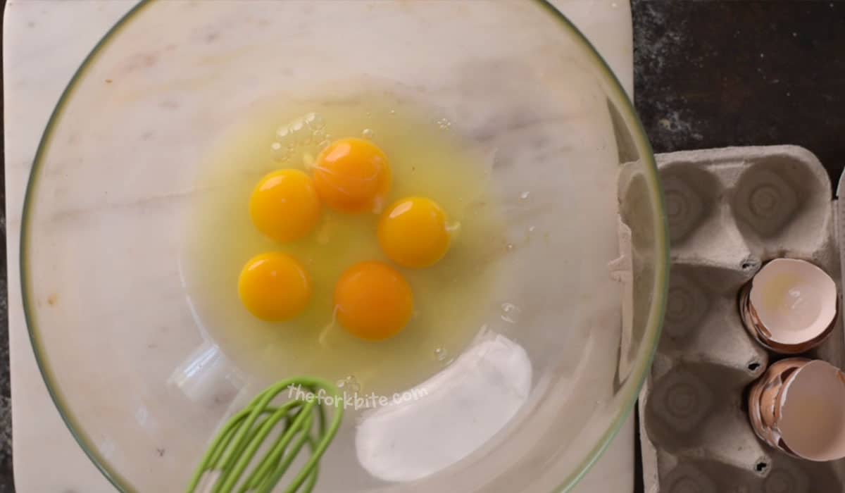 First, prepare the egg mixture by combining the 3 whole eggs and 2 egg yolks in a separate heat-proof bowl. Whisk or beat the egg gently NOT to get that foamy mixture while avoiding too much air. Simply whisk on one direction, if possible.