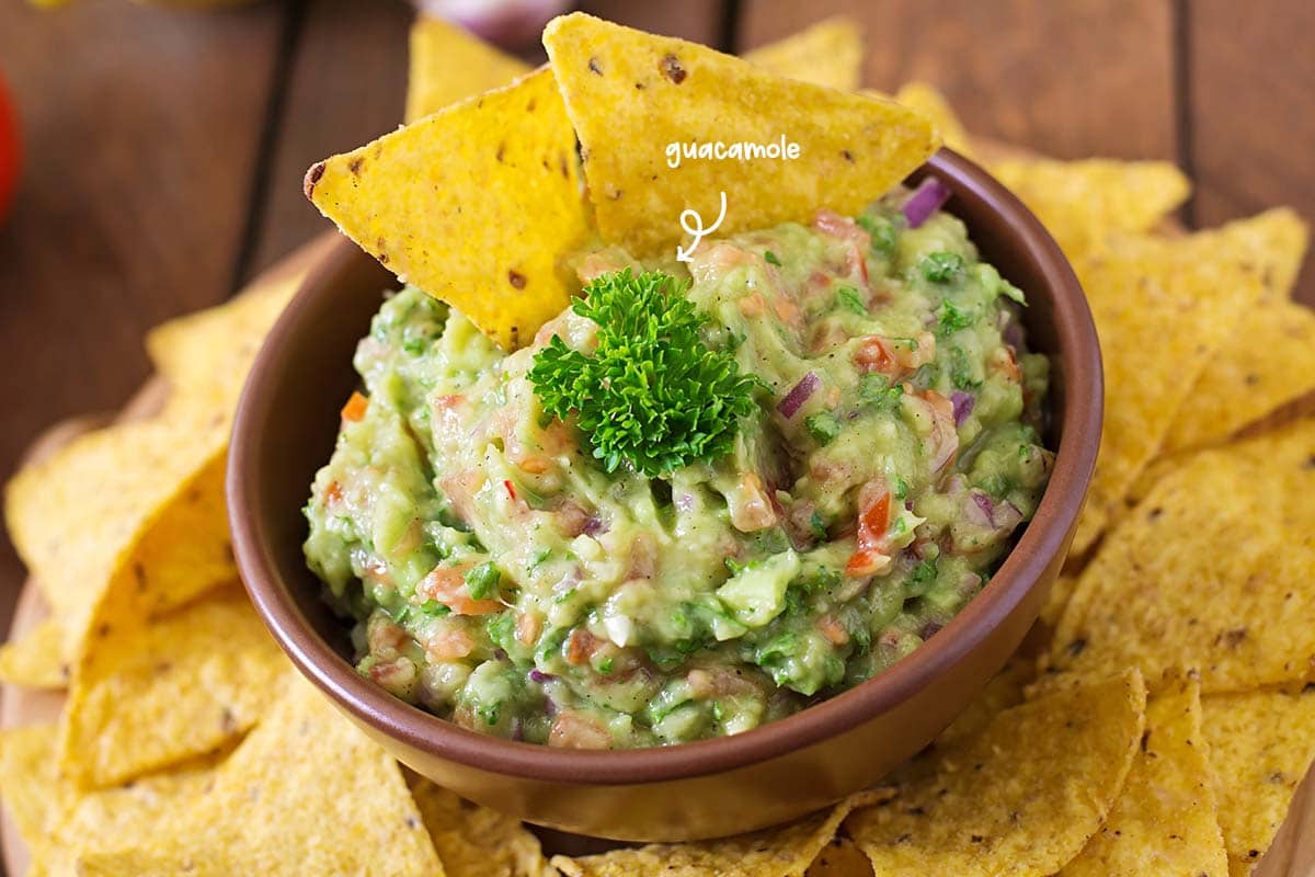 It is quite acceptable to thin the guacamole and sour cream with a little water. It helps the sauces to cover the chips nice and evenly so that no chip is left out.