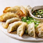 Make this crispy air fryer frozen pot stickers in just 12 minutes with this super easy instructions.