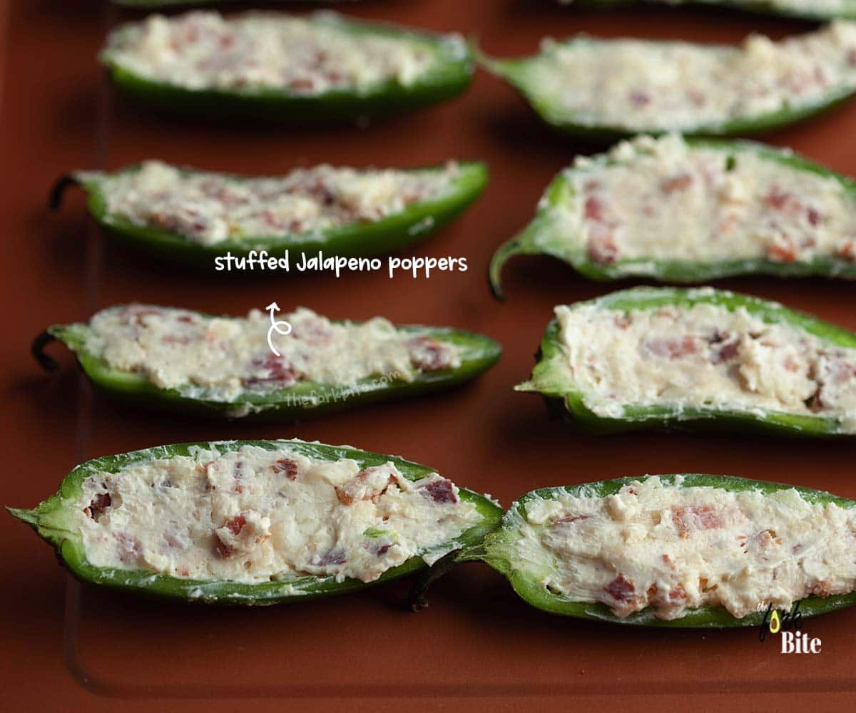 Fill every Jalapeno pepper half with as much filling as it can hold. Be generous and overfill the halves. Don't worry! The puff pastry will hold everything together.