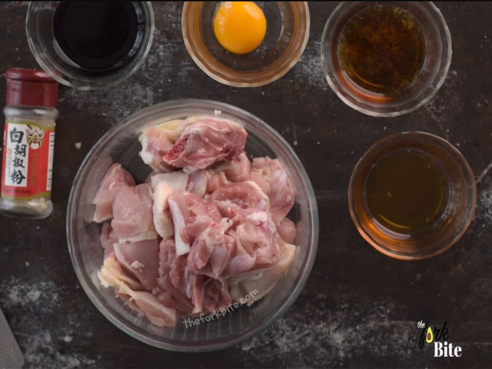 Cut the chicken thighs (with skin on) into desired sizes. Mix the marinade ingredients. Pour the marinade into the chicken cuts and give them a little massage until well coated. Set aside the chicken or store in the fridge.