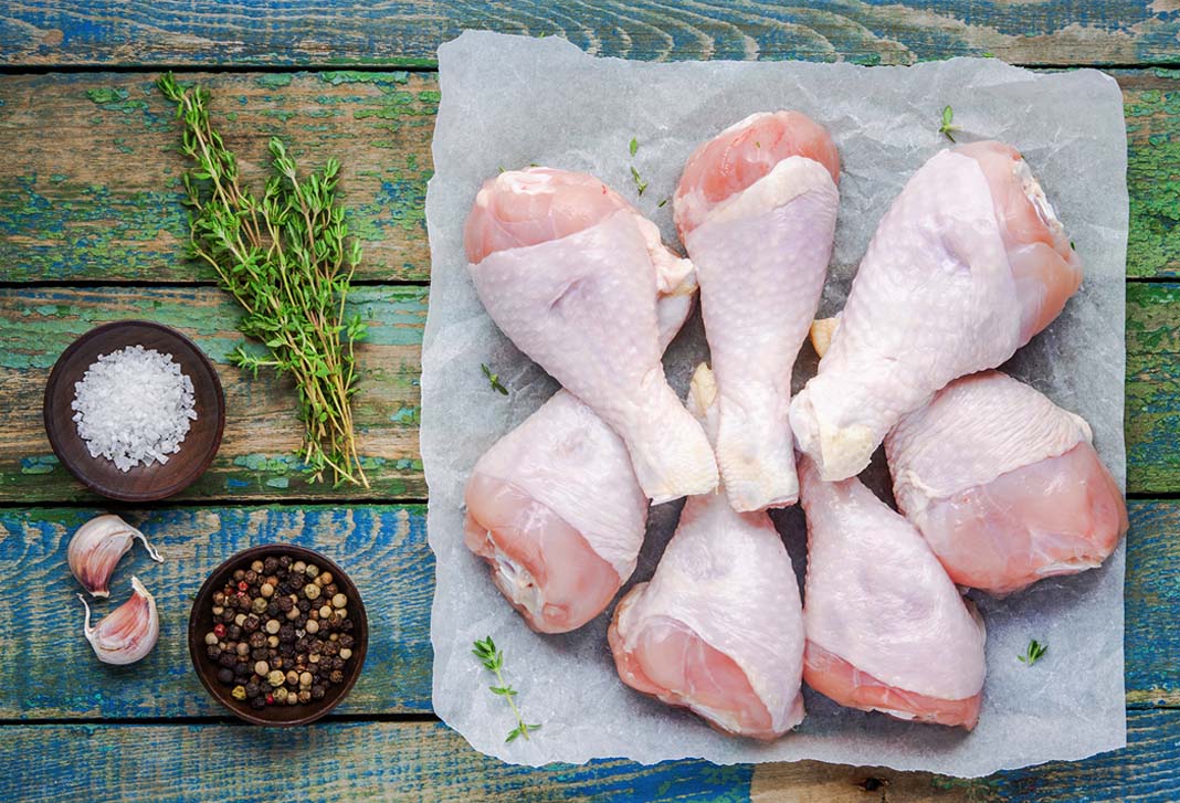 Chicken ought not to be kept outside of the fridge for any longer than two hours. The general recommendation is to throw meat away, both cooked and uncooked, if it has been sitting at room temperature for over this length of time.