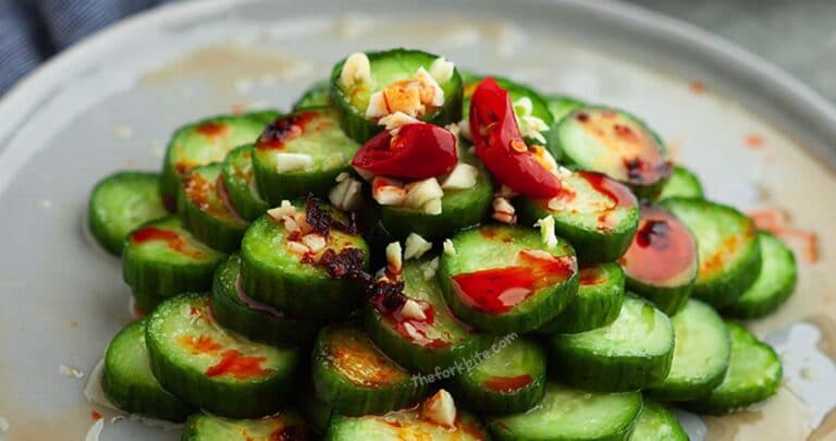 Din Tai Fung Cucumber salad is made with lightly brined Persian cucumbers and dressed in a simple garlicky Asian vinaigrette, made with rice vinegar, soy sauce, garlic, and chili flakes.