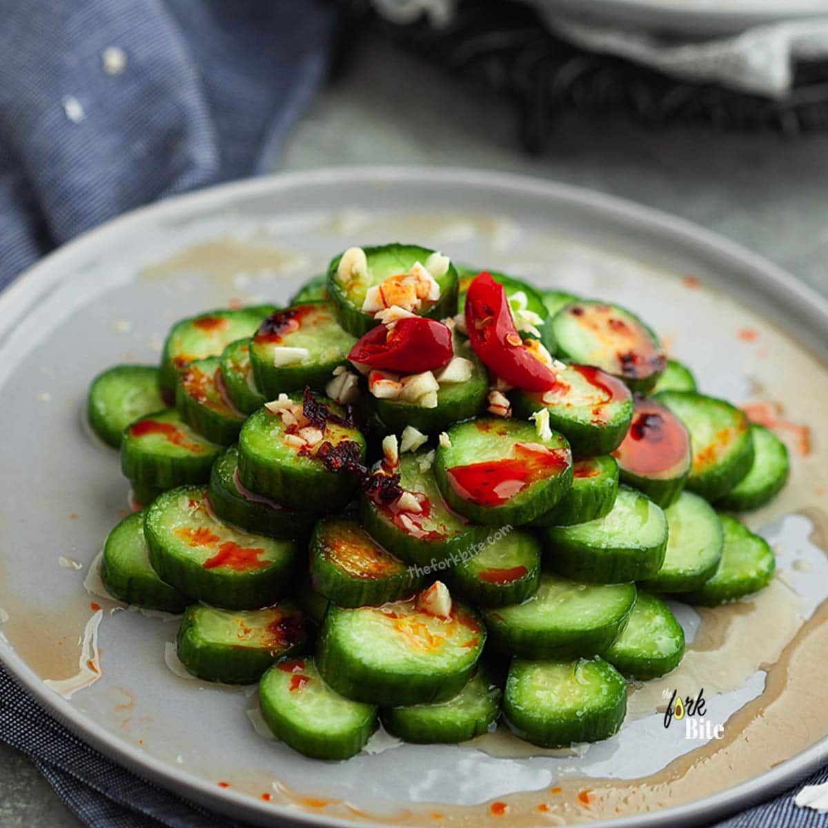 Din Tai Fung Cucumber salad is made with lightly brined Persian cucumbers and dressed in a simple garlicky Asian vinaigrette, made with rice vinegar, soy sauce, garlic, and chili flakes.