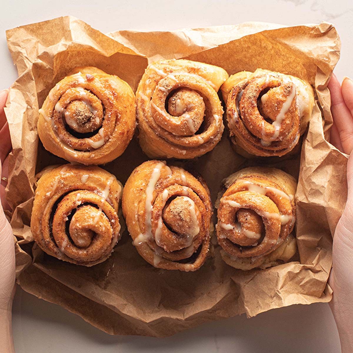 When it comes to reheating any frozen leftover cinnamon rolls, you need to allow them to defrost. This will do if left out at room temperature for an hour or so.