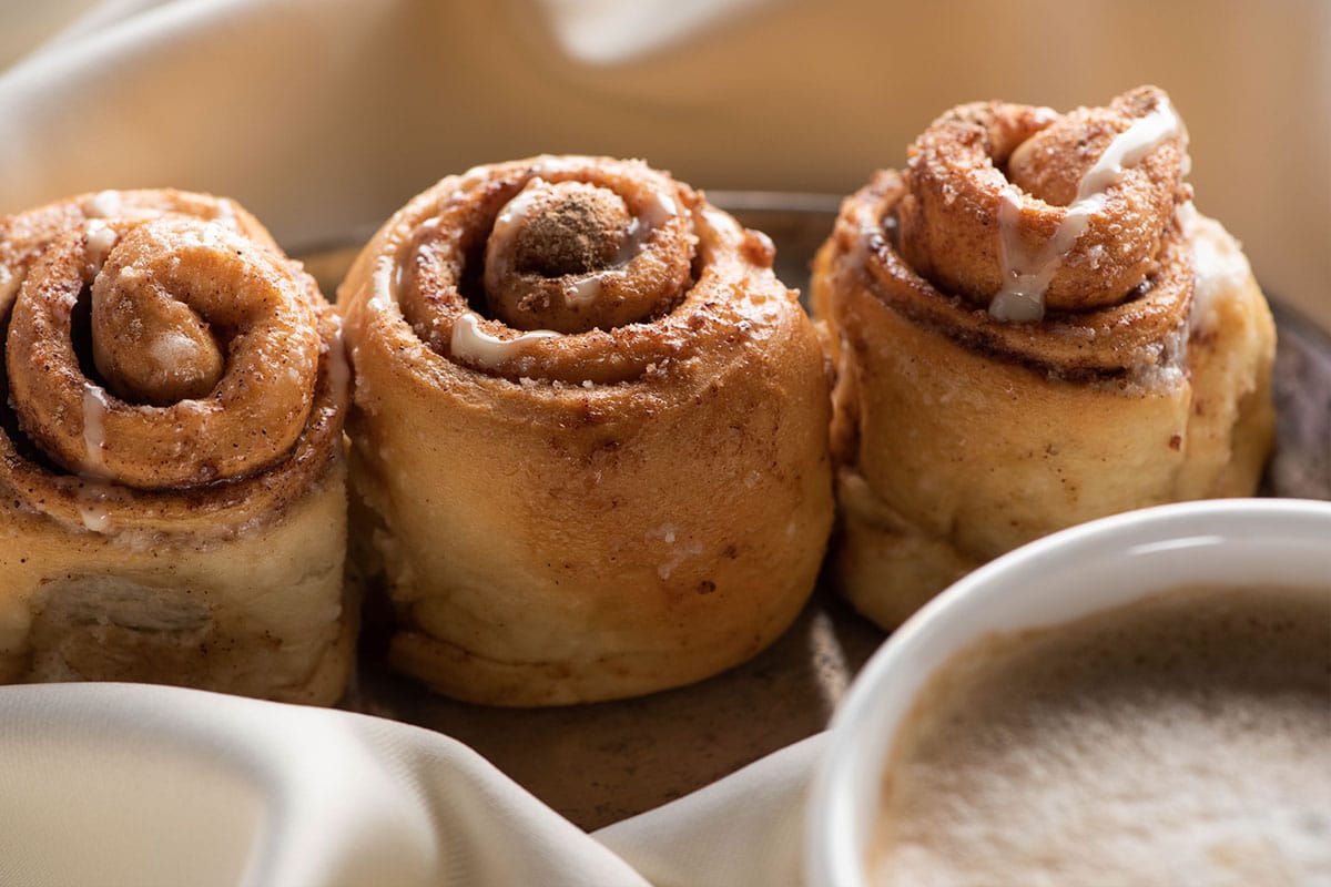 You can also freeze cinnamon rolls after they've been baked but before you ice them. Later on, when you thaw them out, you can then pop them into the oven for a few minutes