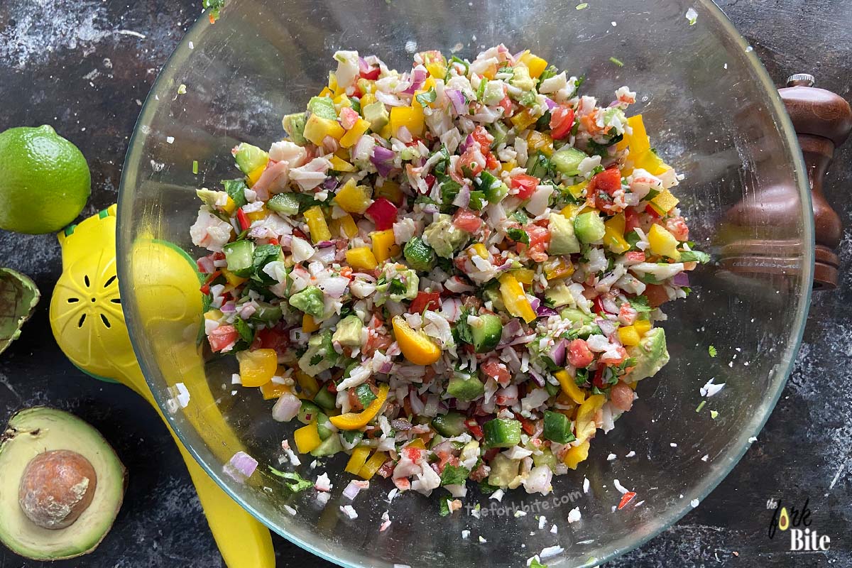 Mix all of the pico the Gallo ingredients plus the crab meat in the bowl. Gently toss them together.