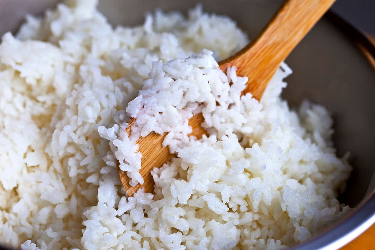 Rice typically lasts anywhere from 11 to 12 hours within a rice cooker. Immediately following this time frame, it will start to lose its moisture content and flavor.