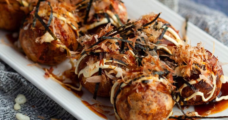 Takoyaki balls are fluffy, rich-tasting dough balls covered in a savory and delicious Takoyaki sauce.