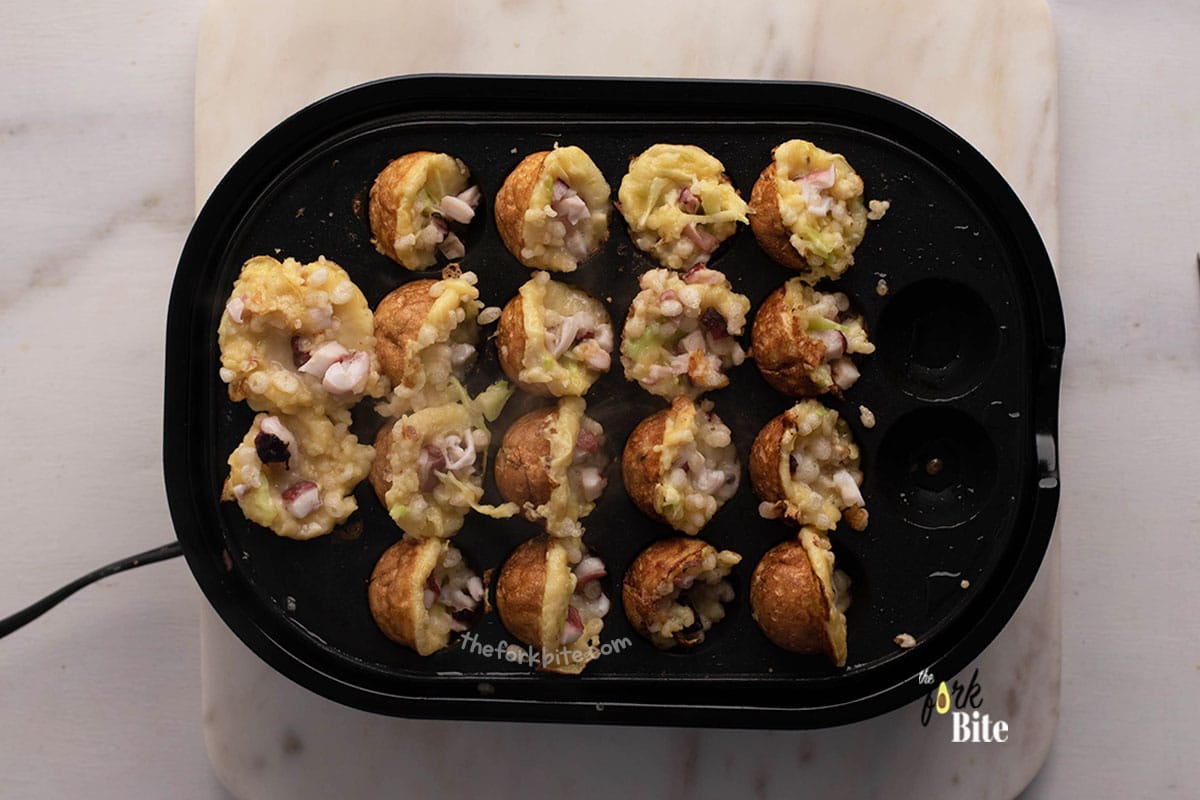 Once you flipped the ball, there would be an opening in the Takoyaki cavity then, you can pour extra batter to fill that space.