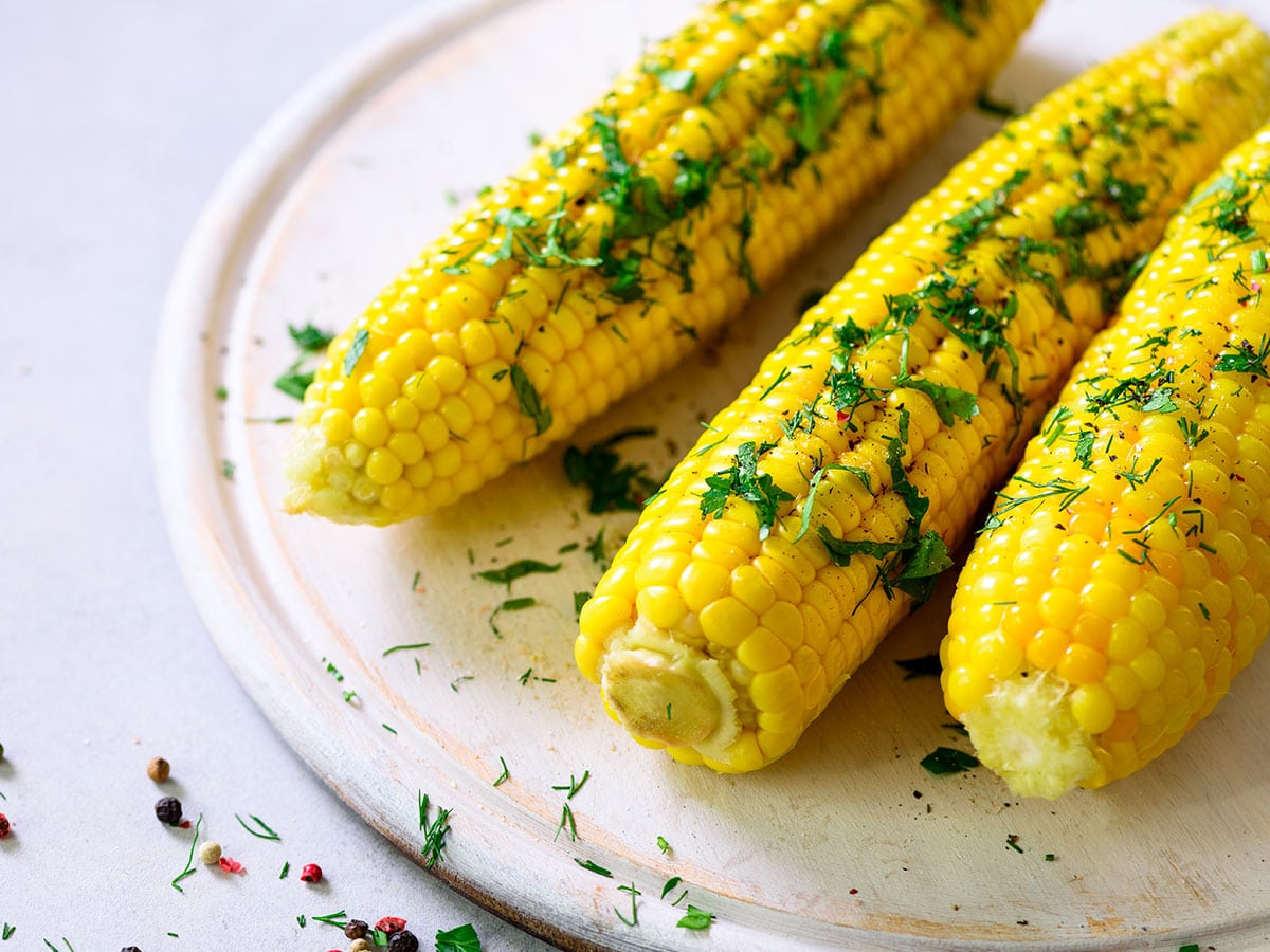 Add your corn to the boiling water, return to the boil, and cover. Boil for approximately five minutes.