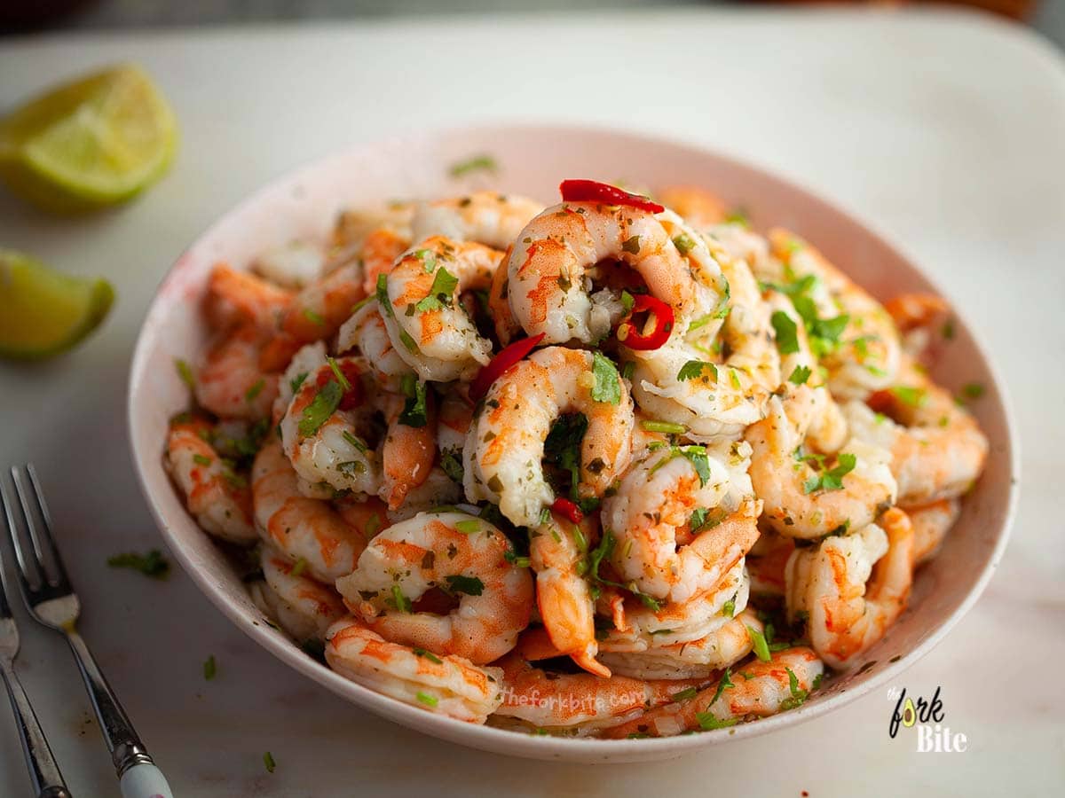 When cooking shrimp, it requires an internal temperature of 120°F to achieve that perfect look. The longer you cook, the more it toughens the texture resulting in a tighter C-shape.