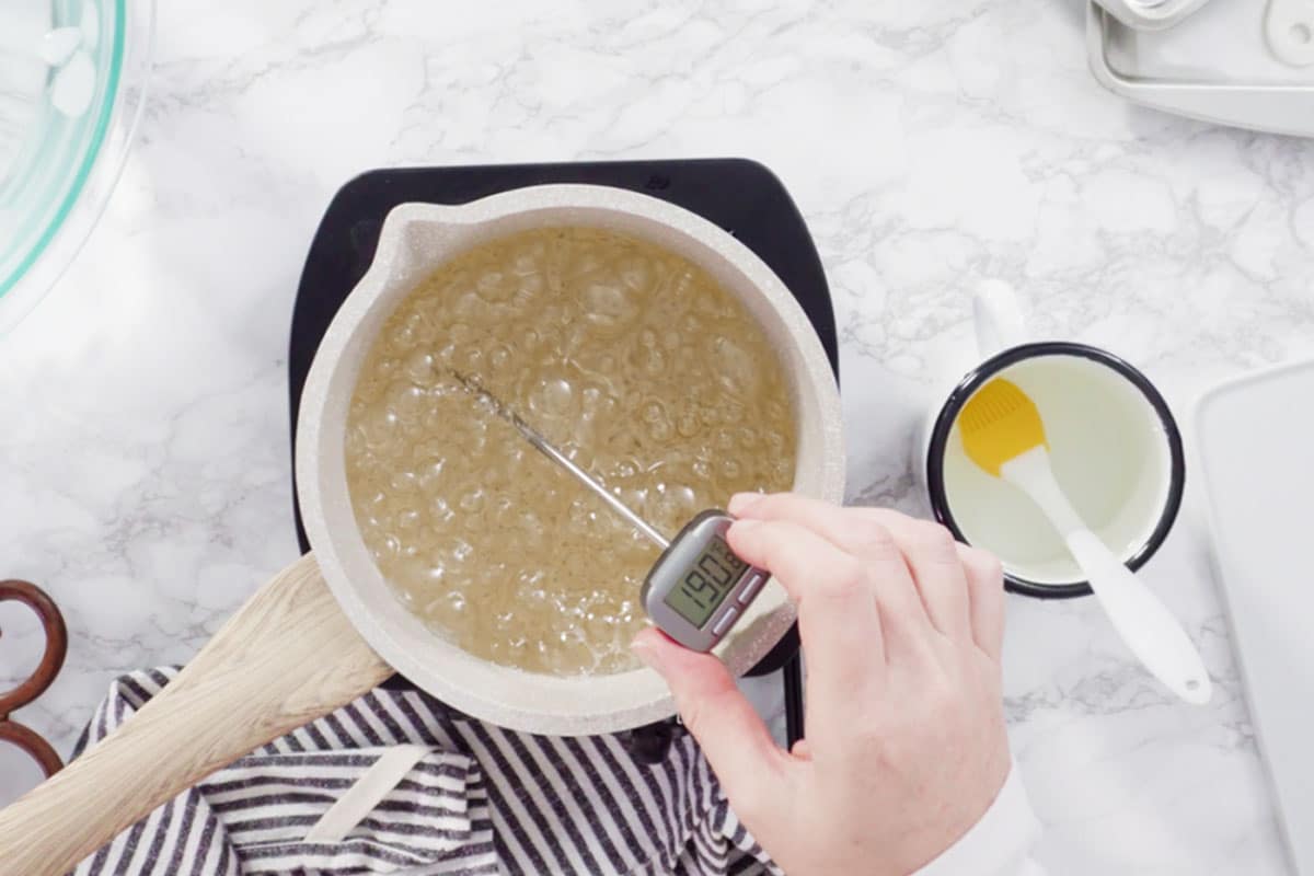 If you want to keep an eye on your sugar syrup's temperature while cooking it, you need to get a candy thermometer.