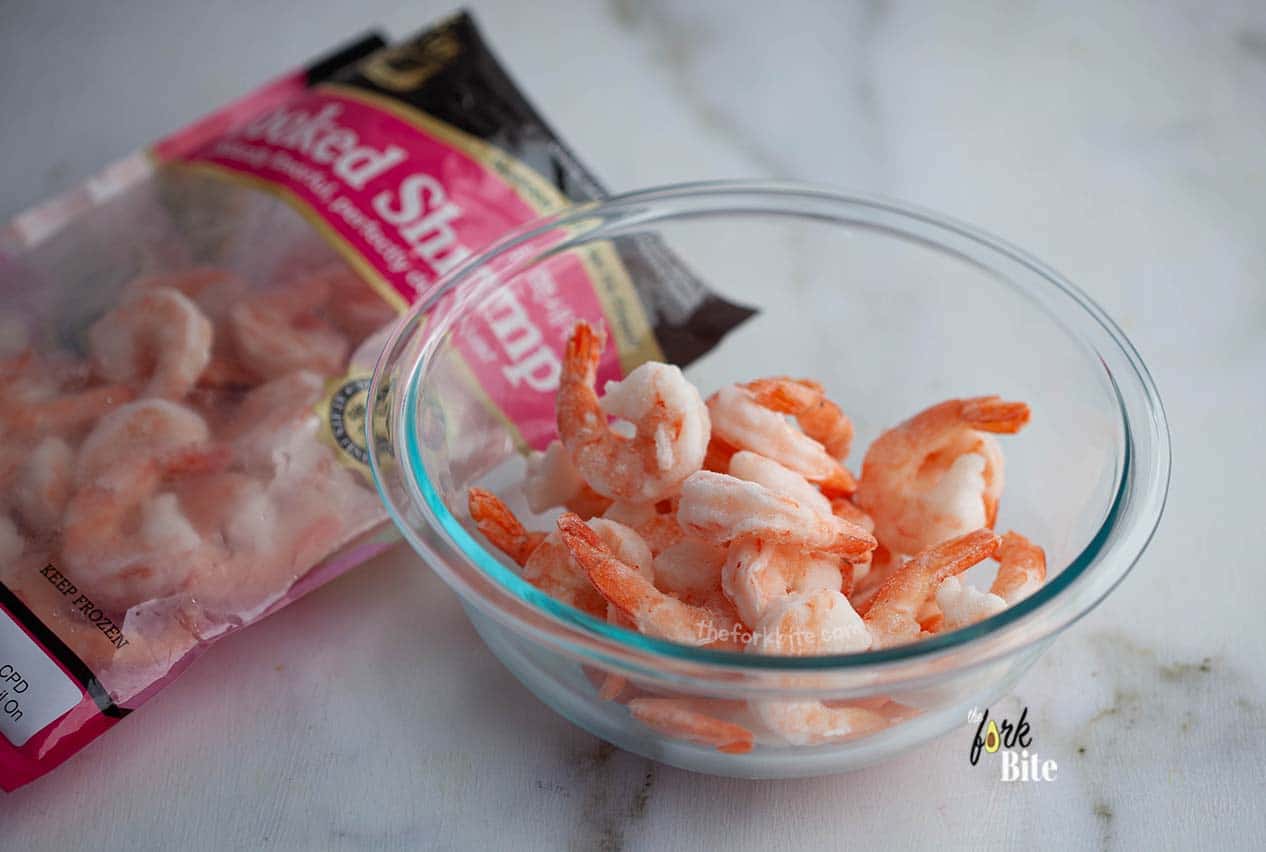 Blanching frozen shrimp is dead easy. It only takes a few minutes, and it helps to maintain flavor and gives them a great texture.