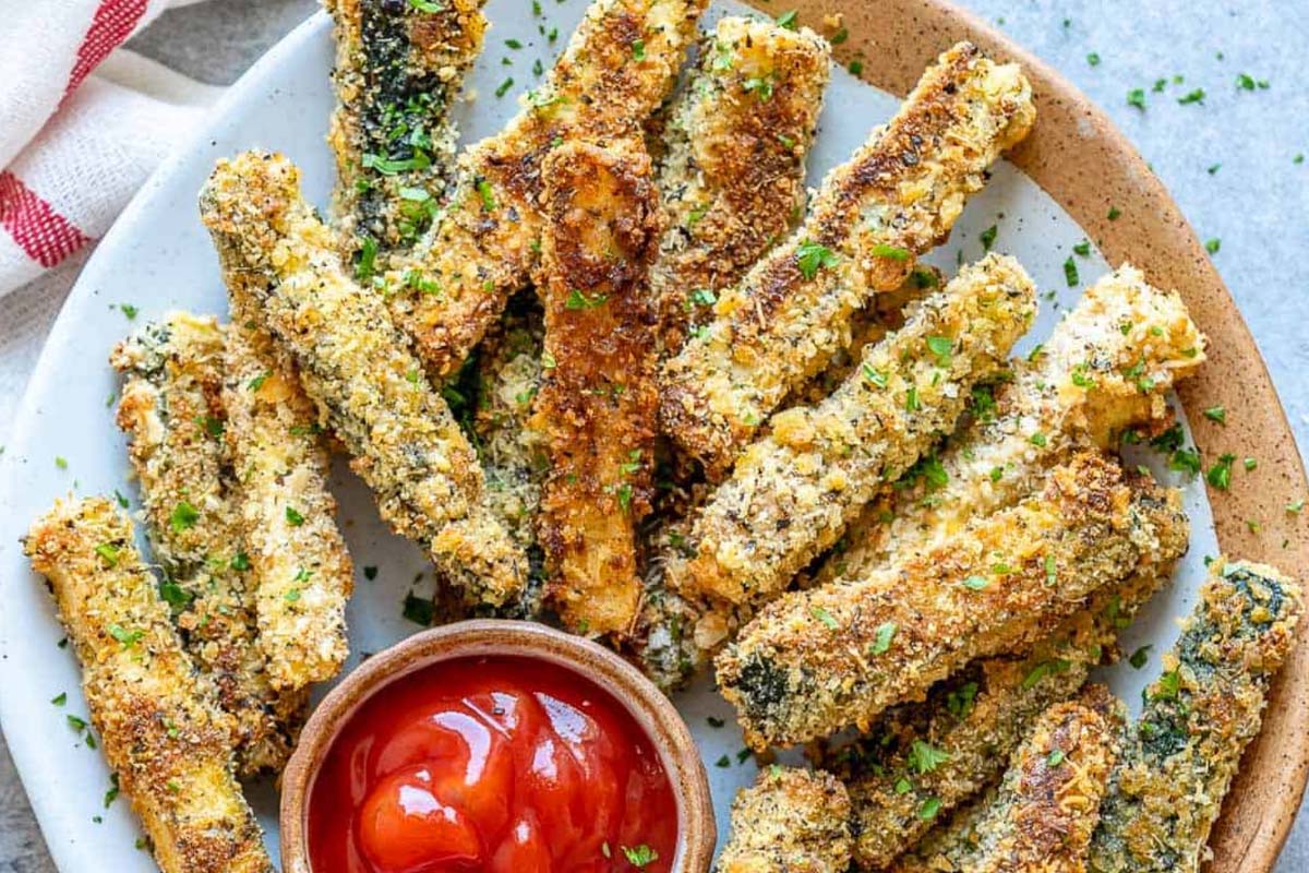 Make up a mixture of flour, Italian herbs, a little salt, and some smoked paprika. Coat the Zucchini chips in olive oil, toss them in the mix, and oven bake for 15 to 20 minutes.