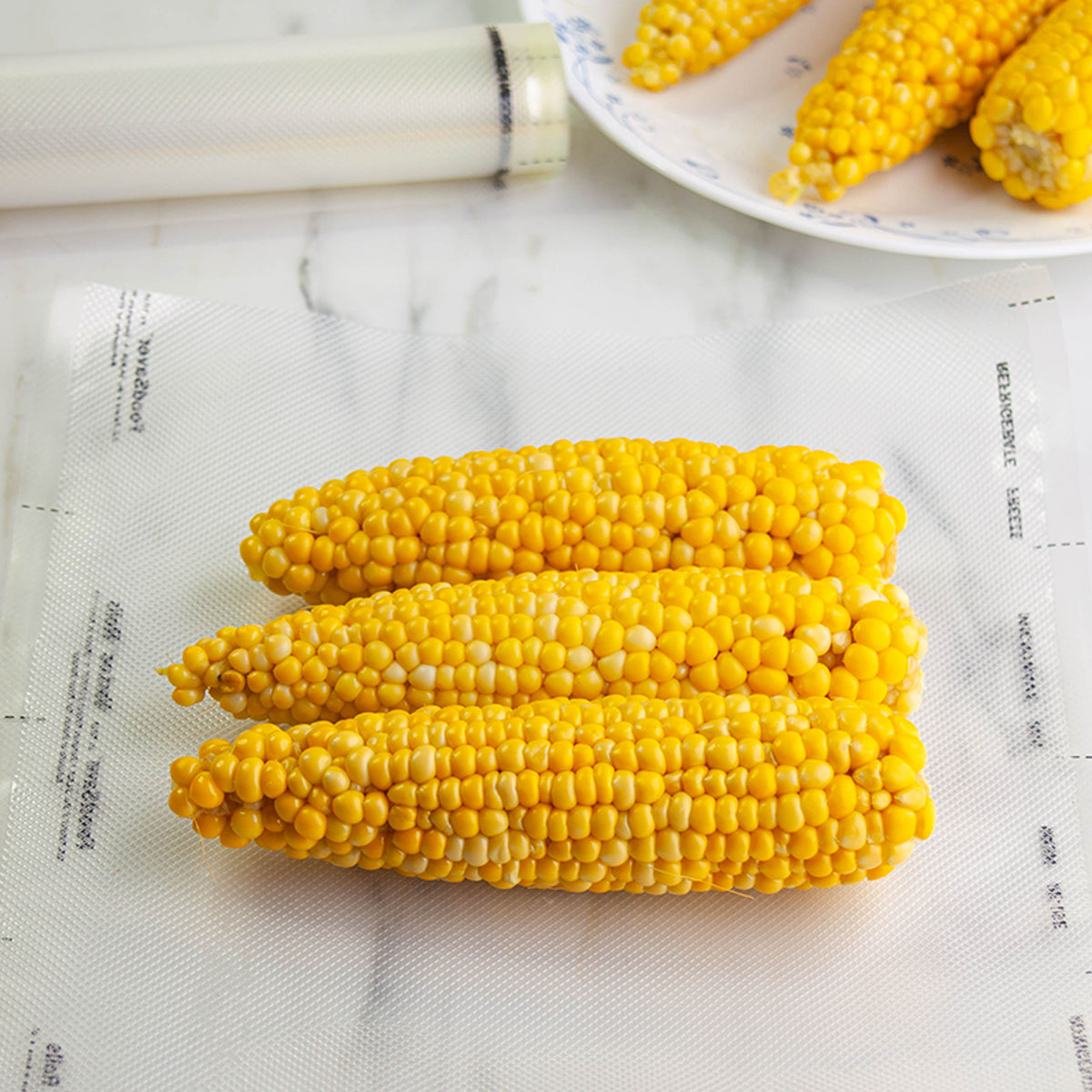 You can store several cobs of corn in one freezer bag. Get as much air out as possible, seal the bag, label, date, and put in your freezer at 0°F or lower.