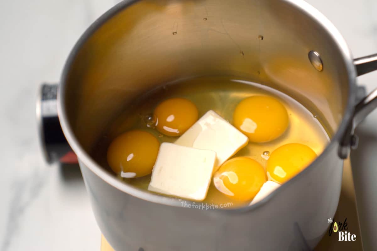 Use cold eggs directly from the fridge. Crack the eggs into a high-sided saucepan (do not use a frying pan).
