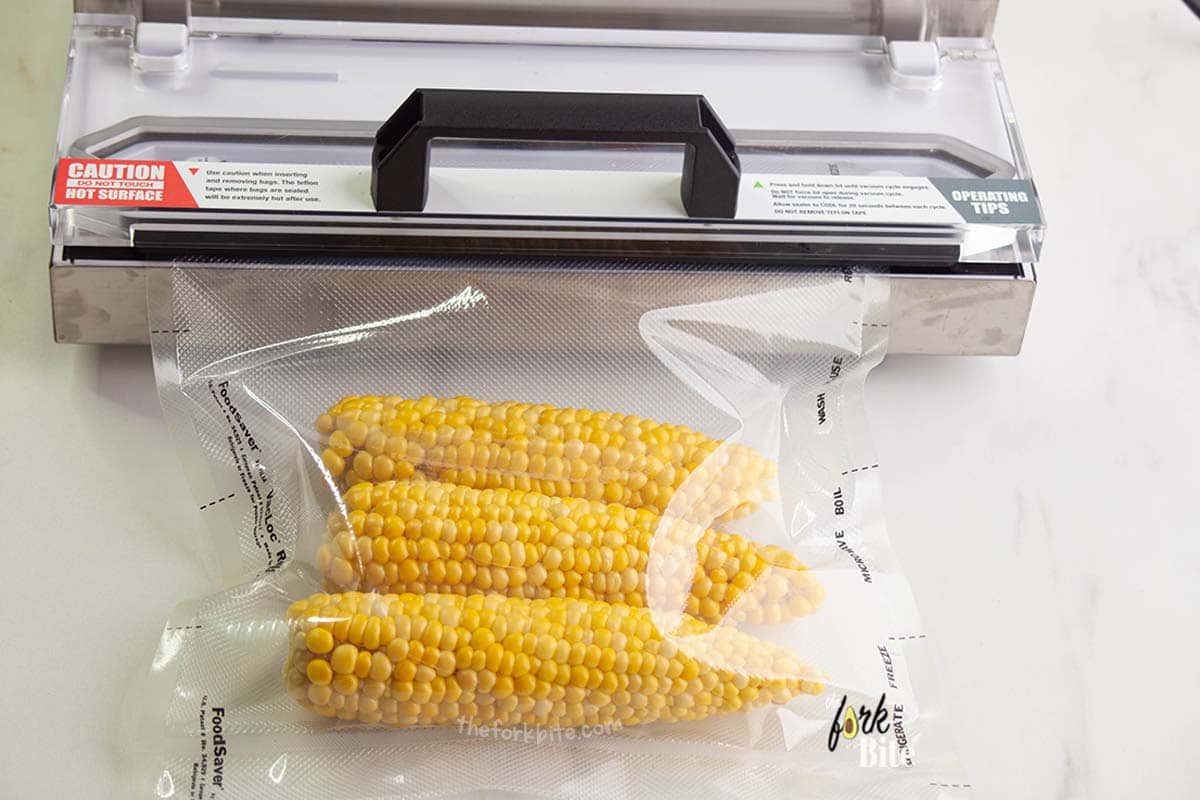 Set the seal level to four or five to help preserve your corn, and then press the “Vacuum” button. After the air comes out of the bag, press the “Seal” button.