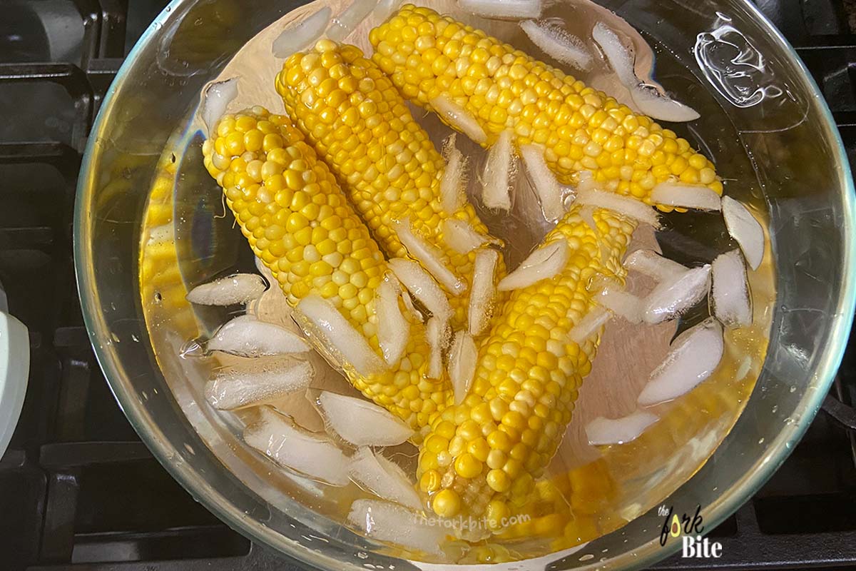 Once blanched, it is crucial to stop the cooking process immediately, which means removing the cobs from the hot water and immersing them immediately in iced water.