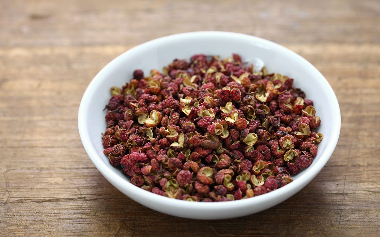 Sichuan peppercorns are seed husks. As well as being spicey, they have a surprising lemon fragrance and have a numbing effect on both your lips and your tongue. This numbing effect also opens up your tastebuds.