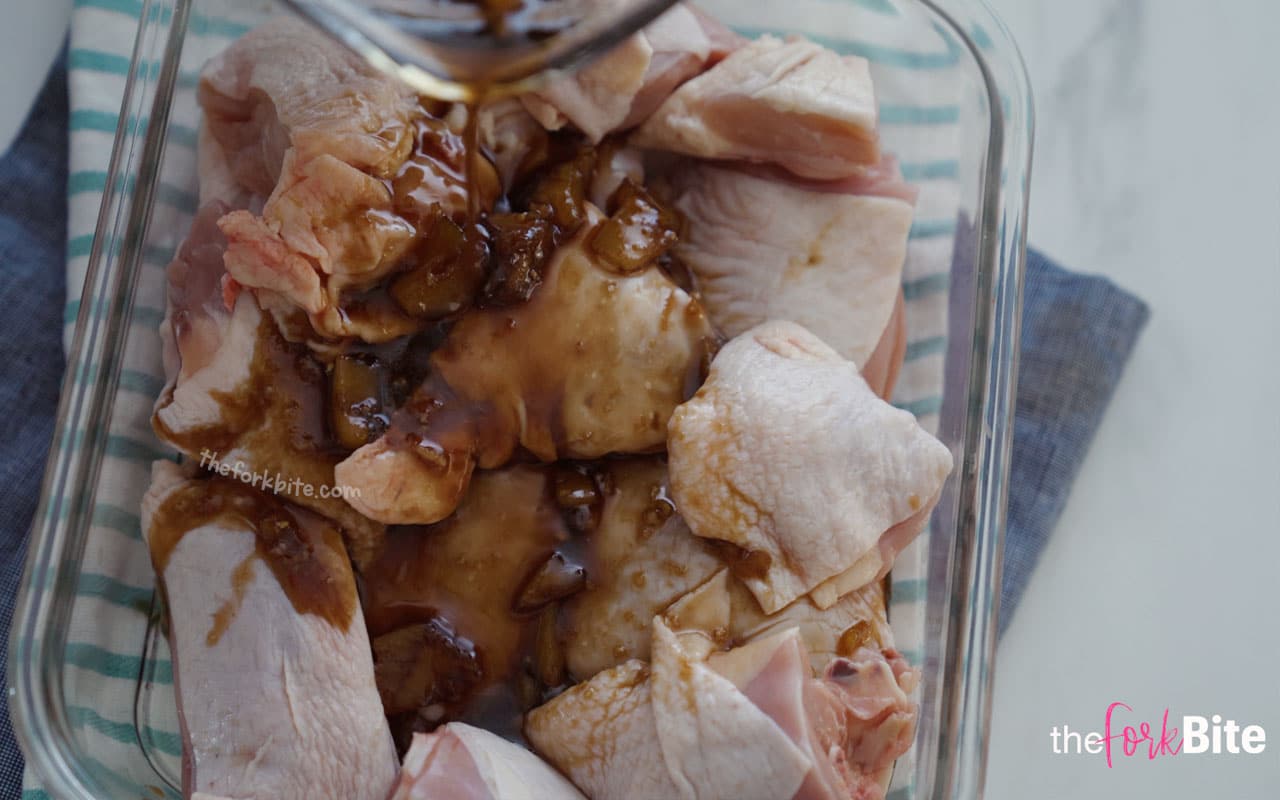 Prep your chicken and place them in a flat bottom dish. Pour half amount of the marinade mixture into the chicken. Mix it to coat them evenly. Cover with a cling-wrap.