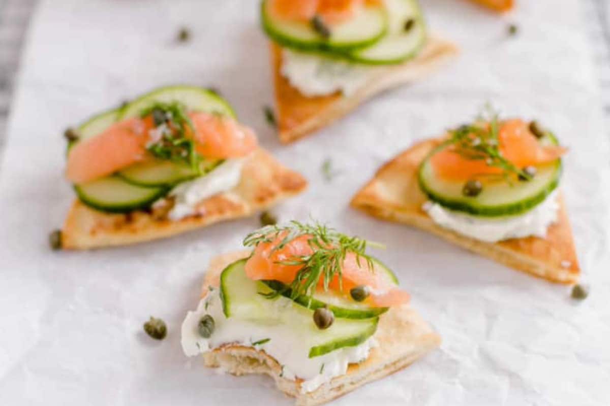 If you are in the party mood, why not kick off with some delicious little triangular baked pita bites with cream cheese, smoked salmon, and a sprinkling of dill?