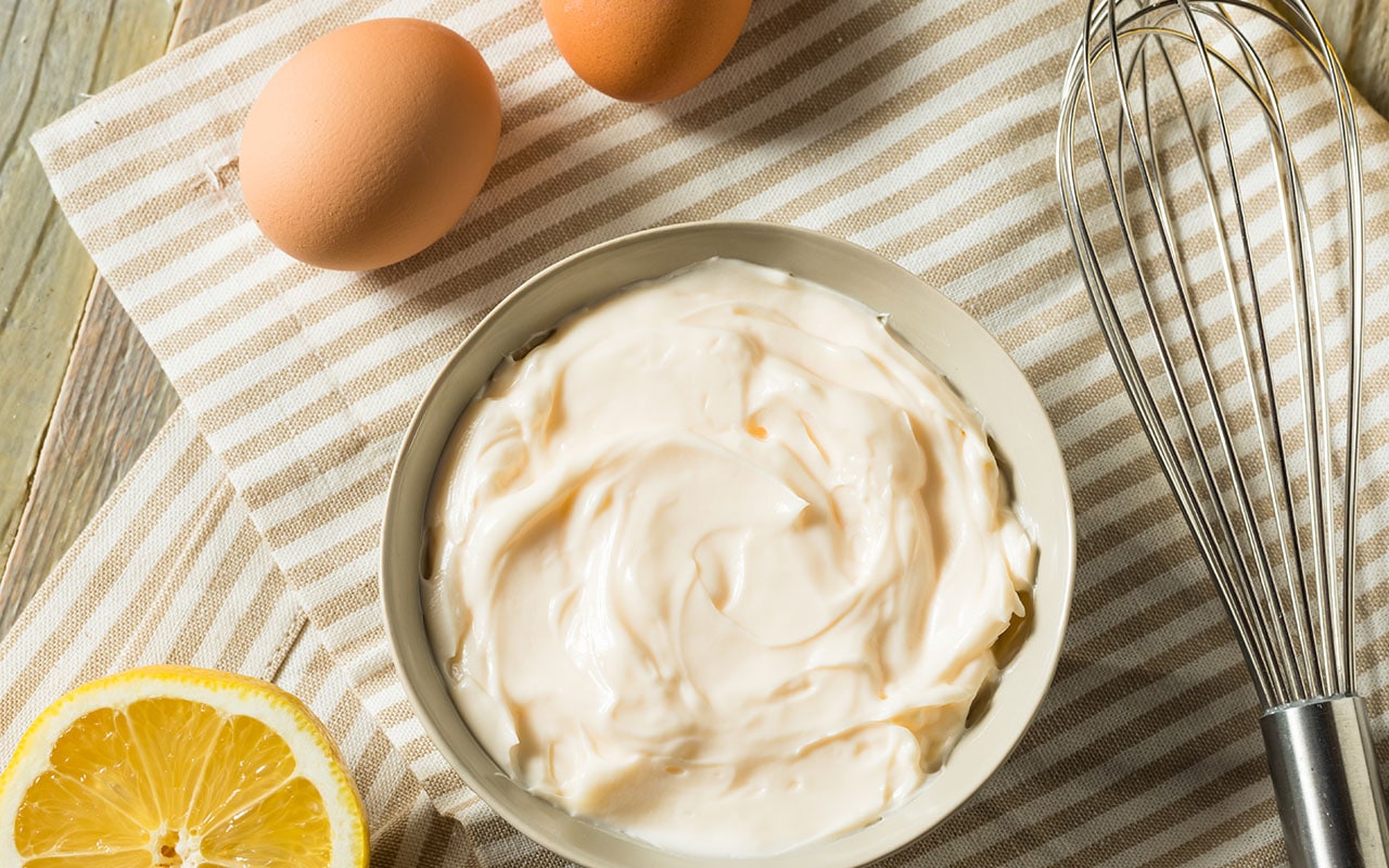 Fill pan three-quarters full with water and bring to a simmer. Do not boil. Spoon the mayonnaise into a heatproof bowl and position it on top of the simmering water.