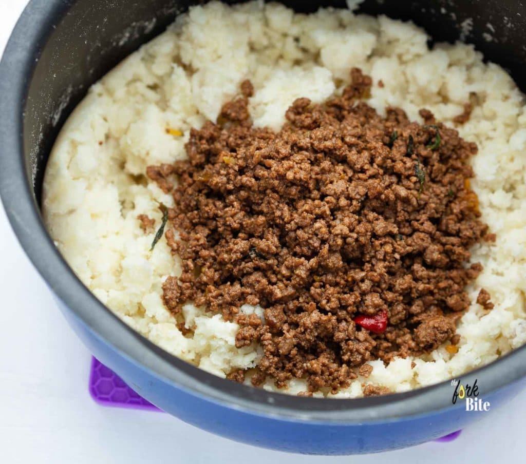 Transfer the beef to the mashed potato. Add 2 tbsp mayonnaise and mix well. Now, you can place the mixture on a large tray and spread it out into a rough rectangle about 1.5 inches thick.