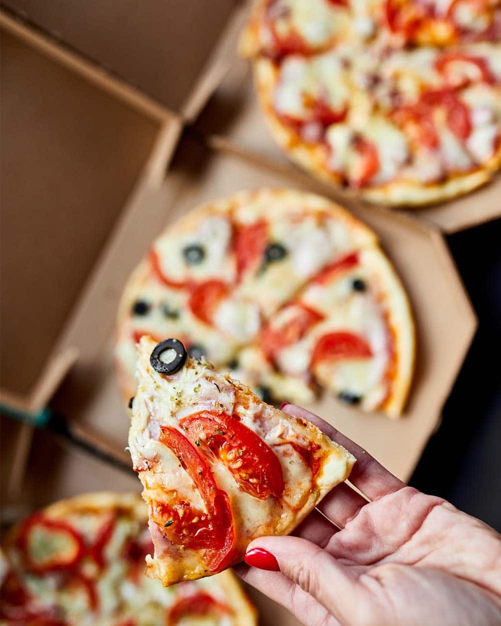 Reheating a pizza in its box usually means there will always be a hint of cardboard in the taste, small though it might be. To avoid it altogether, ditch the box.