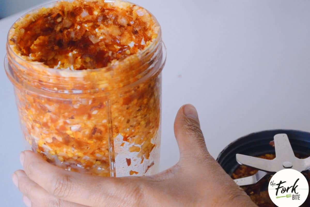 Place the shallots, garlic, and the rehydrated dried chilies in a blender to make a paste.