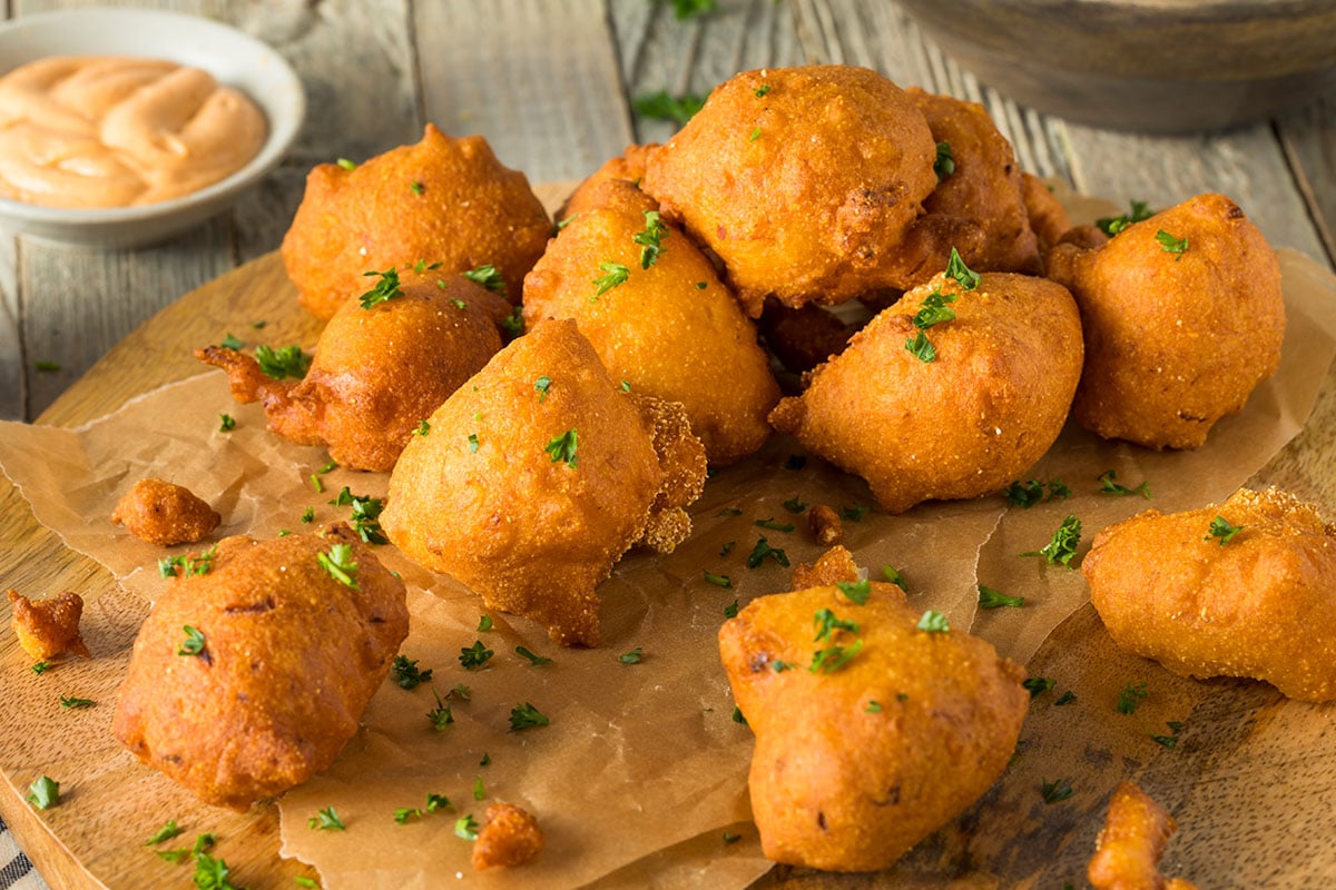 Hushpuppies are a delightful, light, and fluffy fried cornbread dish made from a thick batter based on buttermilk that is quick, deep-fried.