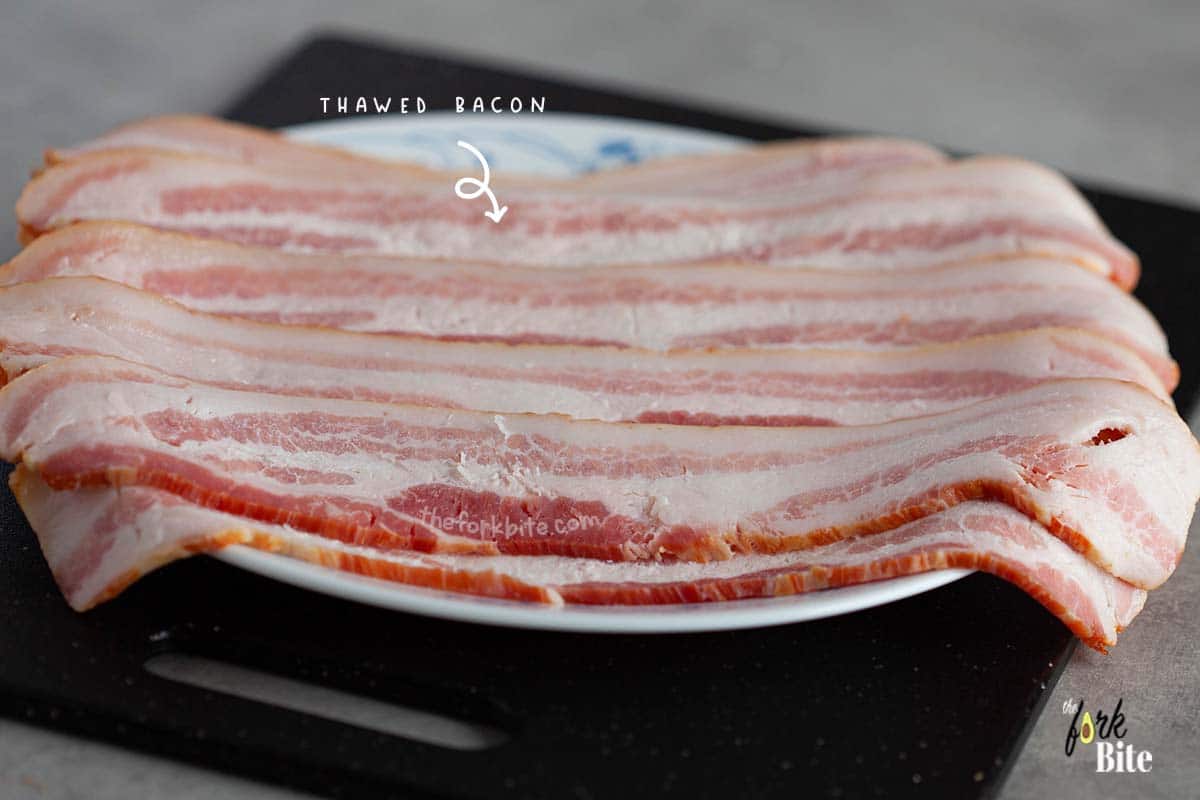 Place the thawed bacon on a separate plate. It is vital to microwave in short bursts, say 30 to 60 seconds at a time. It will allow you to judge how the thawing process is progressing.