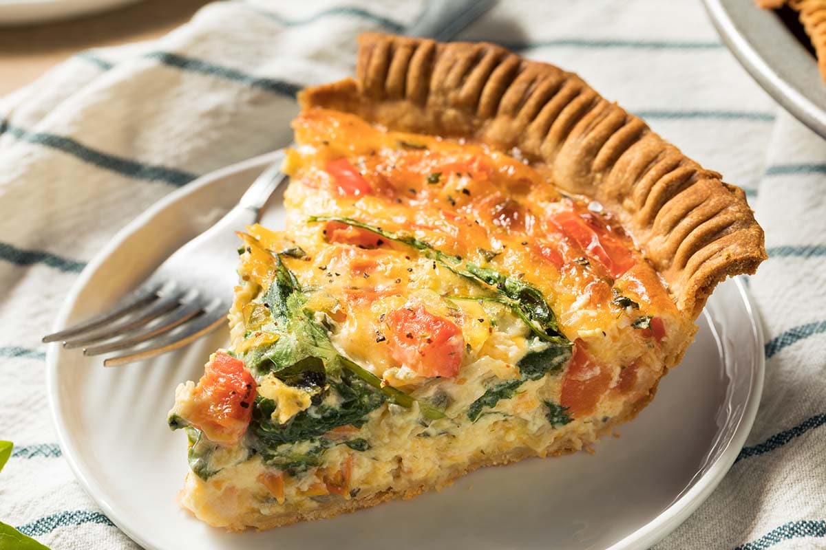 So what is quiche? It’s not that complicated. It is a pastry casing filled with lovely savory eggy custard plus some cheese or meat or seafood or some veggies. They all work well.